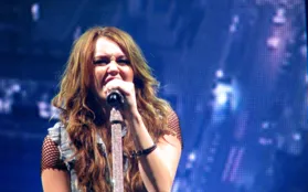 Miley Cyrus Stuns at Hannah Montana 20th Anniversary Premiere in Silver Look
