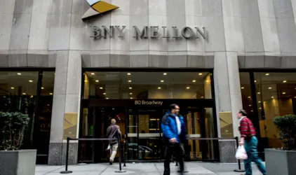 BNY Mellon's quarterly profit halved
