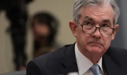 Fed says new COVID Omicron strain threatens economic recovery
